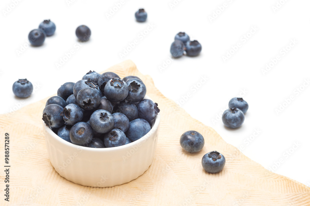 Ripe blueberries in a bowl close-up on a white. Blueberry picking Ripe blueberries in a bowl close-up on a white. Blueberry picking