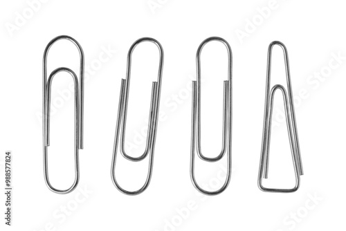 A collection of various paper clips arranged on a clean surface showcasing different shapes and sizes in an organized manner. Isolated