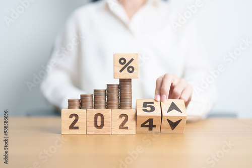 2024 to 2025 New year with percentage change to UP and Down arrow with coin stack. Interest rate, GDP, stocks market, financial, deflation and Inflation, mortgage, debt, Loan and Economic Recession