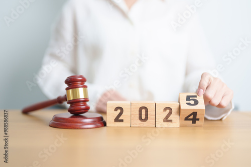 2024 end year to Happy New Year 2025 with judge gavel on table. Law, lawyer, judgment, justice auction and bidding concept photo