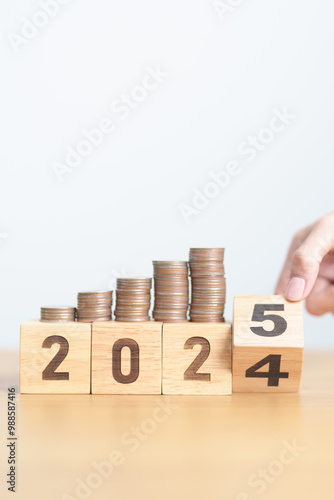 2024 end year to Happy New Year 2025 with Coins stack. Money, Budget, tax, investment, financial, savings and New Year Resolution concepts