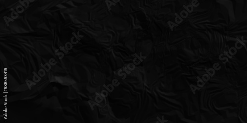 Black crumpled paper texture . Black wrinkled paper texture. Black paper texture . Black crumpled and top view textures can be used for background of text or any contents .