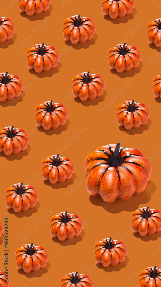 Pattern of orange pumpkins on orange background vertical banner Pattern of orange pumpkins on orange background vertical banner