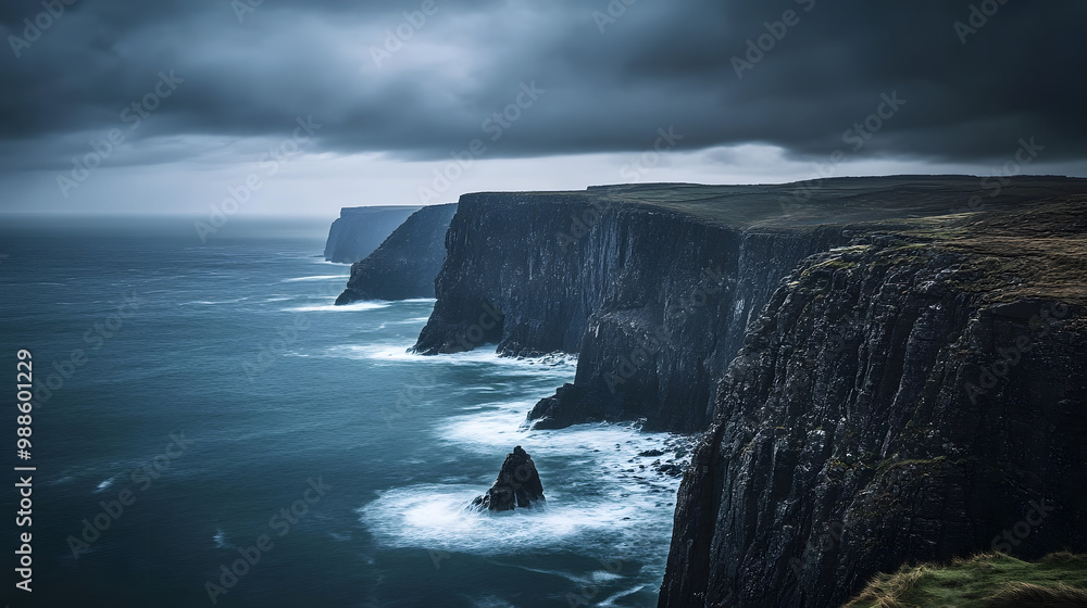 A dramatic seascape with rugged cliffs meeting the Atlantic Ocean under stormy skies. A dramatic seascape with rugged cliffs meeting the Atlantic Ocean under stormy skies.