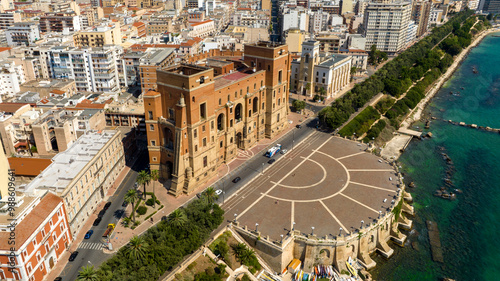 Aerial view of the Government Palace in Taranto, Puglia, Italy. It is the seat of the Prefecture and the provincial administration. The building overlooks the seafront and Marinai d'Italia roundabout. photo