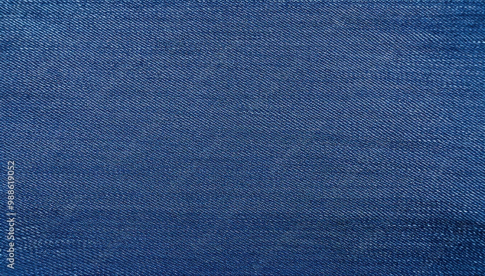 Close-Up Texture of Woven Blue Denim Fabric with a Slight Fade, Highlighting Fine Thread Details and Subtle Variations in Color Across the Surface Close-Up Texture of Woven Blue Denim Fabric with a Slight Fade, Highlighting Fine Thread Details and Subtle Variations in Color Across the Surface