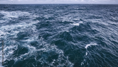 Vast Ocean Waves in Motion. Turbulent Aqua Blue Waters with White Foam Crests, Capturing the Natural Energy of the Sea in a Dynamic, Overhead Perspective