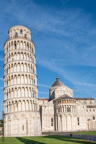 historical landmark leaning tower of Pisa in Tuscany Italy campanile bell tower of cathedral. Iconic tourist attraction and photo opportunity with no people on sunny blue sky summer day