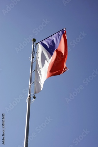 Czech national flag on flagpole in wind photo