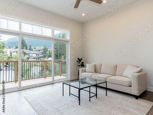 Spacious living room with glass coffee table and sofa 