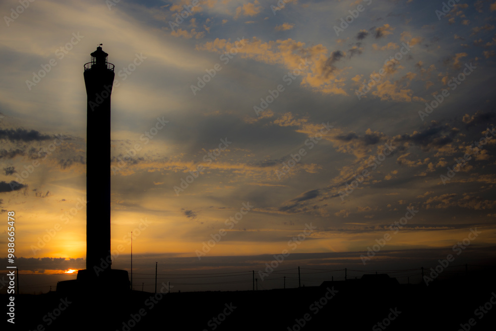 Dungeness lighthouse silhouette at sunset Dungeness lighthouse silhouette at sunset