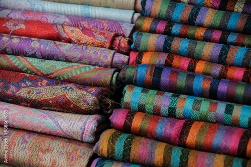 Closeup detail of colorful, patterned cashmere pashmina scarves. photo