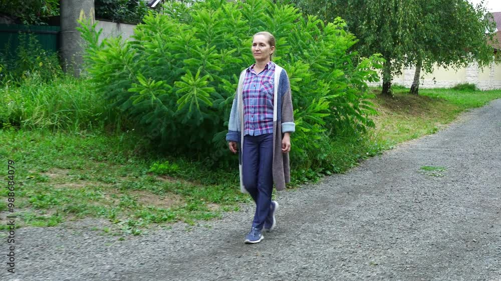 Senior woman walks relaxing outdoor Senior woman walks relaxing outdoor