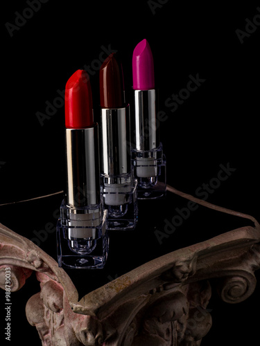 Beautiful lipsticks on black background