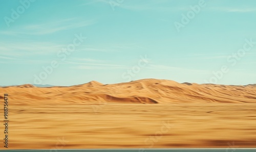 Sandy dunes under a clear sky.