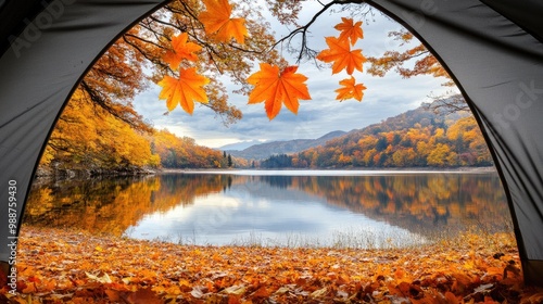 A stunning autumn landscape unfolds outside the tent with vibrant orange trees, a serene lake, and majestic mountains in the backdrop