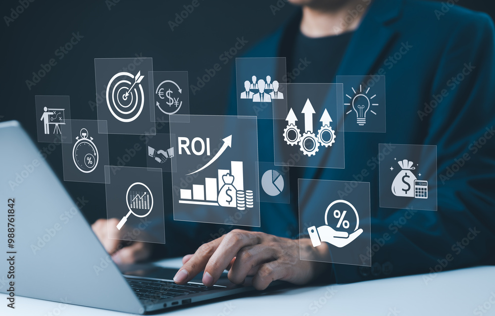 © Supatman - Analyzing ROI and Business Strategy Concepts. Businessman working on a laptop with various digital icons representing ROI, financial strategies, return on investment, and efficiency. marketing plan,