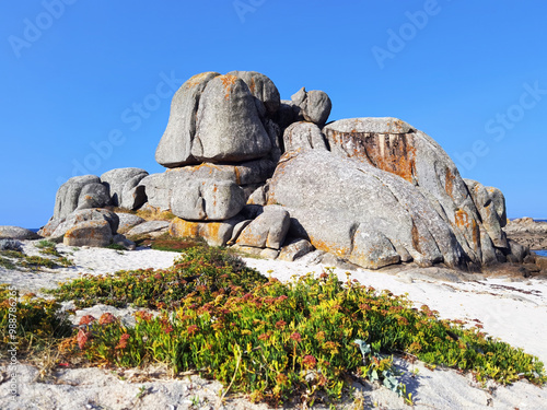 Typical rock formations of the Atlantic coast of O Grove villaje  in Pontevedra province , Galicia ,Spain photo