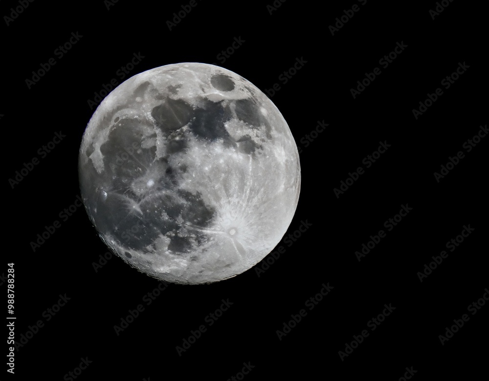 Fototapeta premium Full moon illuminating the night sky, representing lunar phases, astronomy, and nighttime beauty.