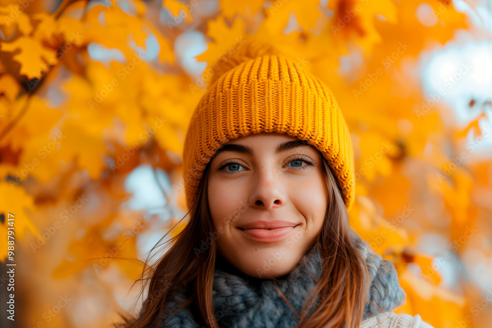 Smiling Woman in Yellow Beanie Surrounded by Autumn Leaves Smiling Woman in Yellow Beanie Surrounded by Autumn Leaves