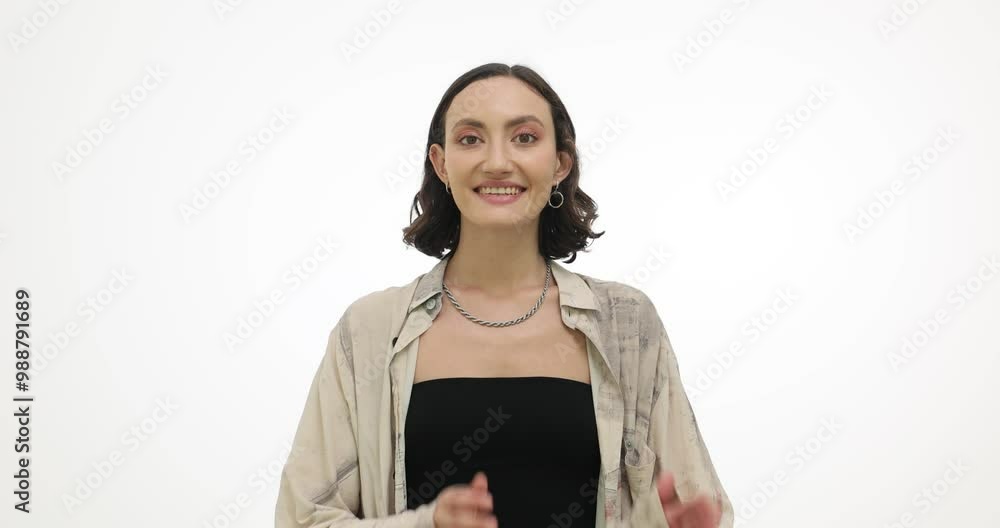Cheerful young woman claps hands on white background in studio. Attractive brunette female with pleasant smile radiates happiness and joy Cheerful young woman claps hands on white background in studio. Attractive brunette female with pleasant smile radiates happiness and joy