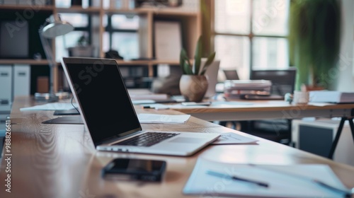 Wallpaper Mural A spacious, modern office with a sleek laptop on a pristine desk, surrounded by well-organized paperwork and a contemplative ambiance enhancing productivity. Torontodigital.ca