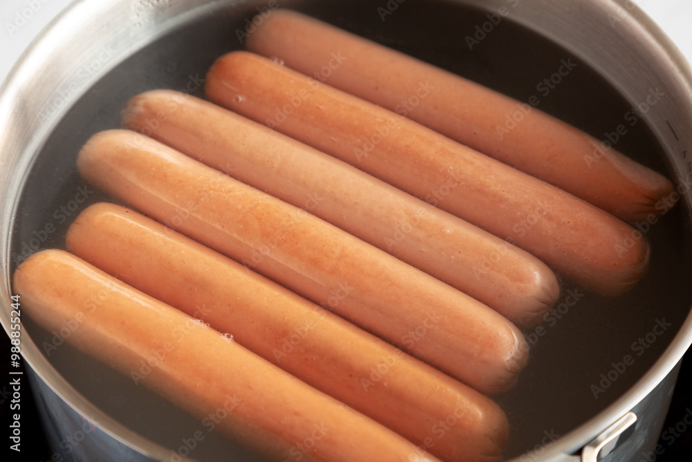 Homemade Boiled Hot Dogs in Water. Close-up. Homemade Boiled Hot Dogs in Water. Close-up.