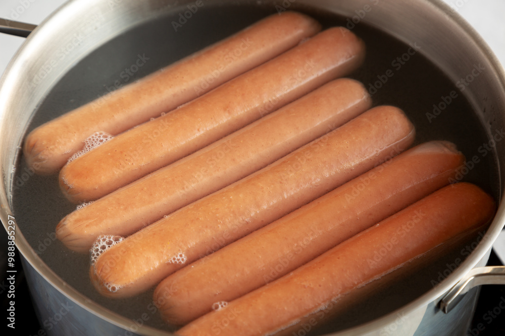 Homemade Boiled Hot Dogs in Water. Close-up. Homemade Boiled Hot Dogs in Water. Close-up.