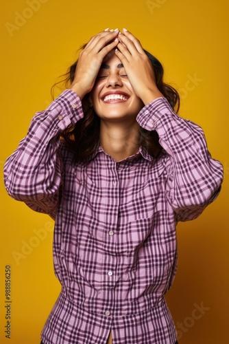 Cs student happy covering her eyes with doth hands photography background clothing. photo