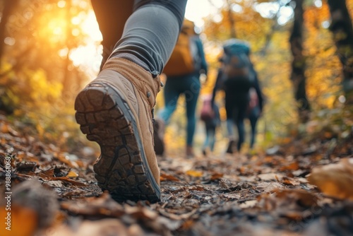 Young people hiking in forest outdoors autumn adventure.