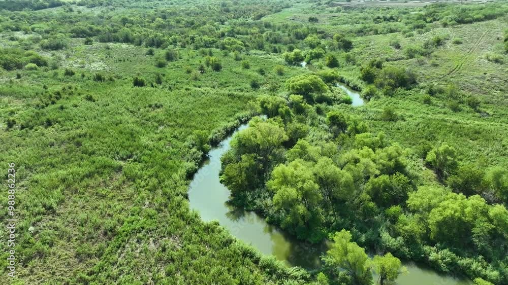 flying over a winding river flying over a winding river