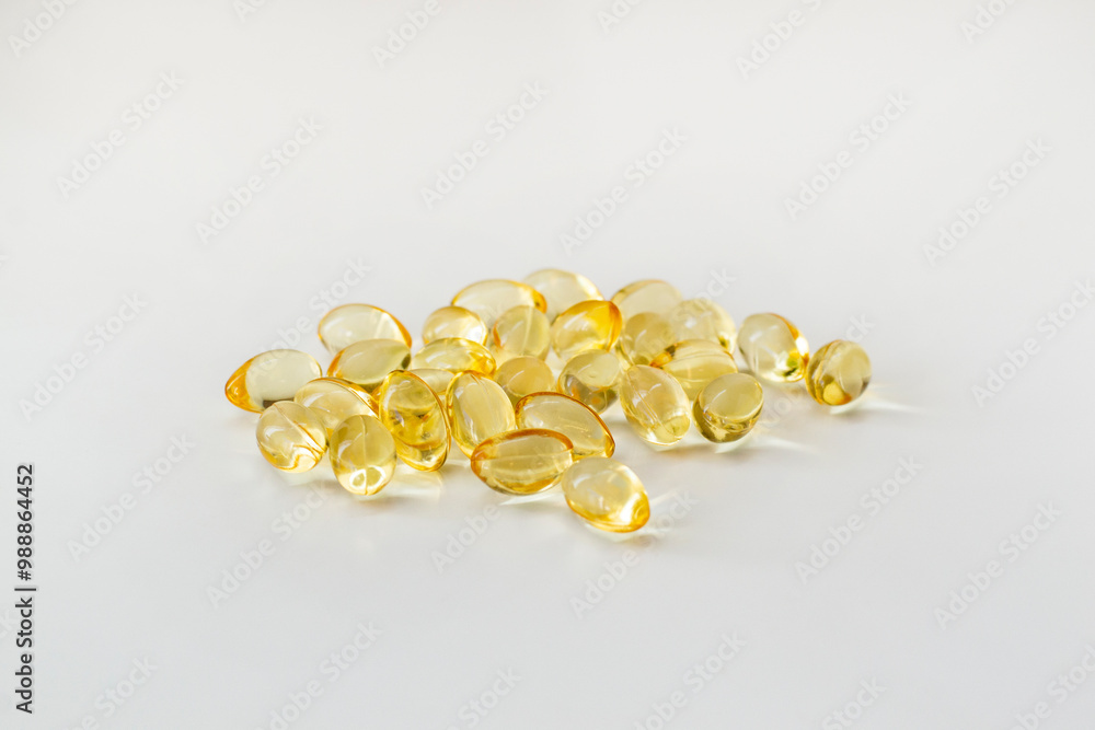 Cod liver oil vitamin e soft gel capsules on white background Cod liver oil vitamin e soft gel capsules on white background