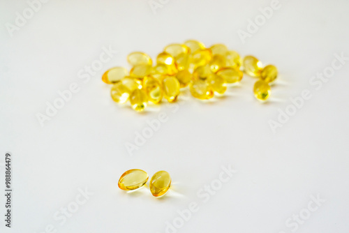 Cod liver oil vitamin e soft gel capsules on white background