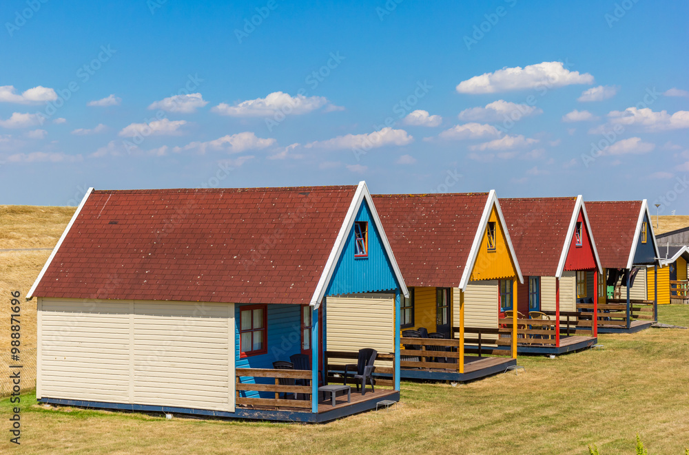 Colorful cottages at the dike in Termunterzijl, Netherlands
