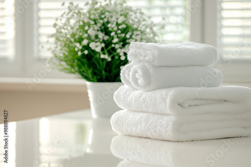 stack of clean fresh bath towels on the table