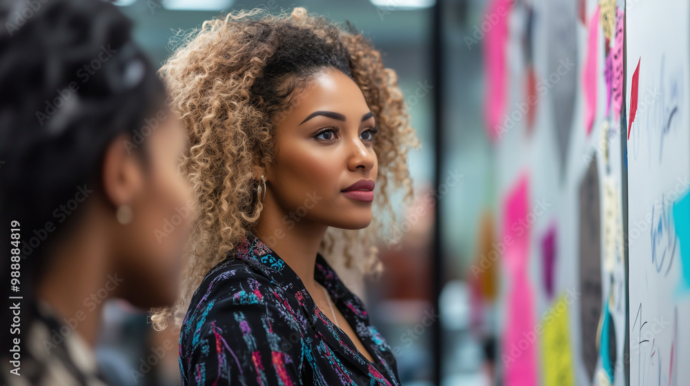 African woman stands in a conference room in a professional workplace. Mature business woman preparing to join her colleagues in a meeting. Commercial presentation African woman stands in a conference room in a professional workplace. Mature business woman preparing to join her colleagues in a meeting. Commercial presentation