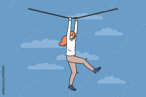 Frightened woman faces risk and danger as she navigates way along rope suspended high in sky. Young girl experiences fear and horror but fights challenge on path to success despite risk