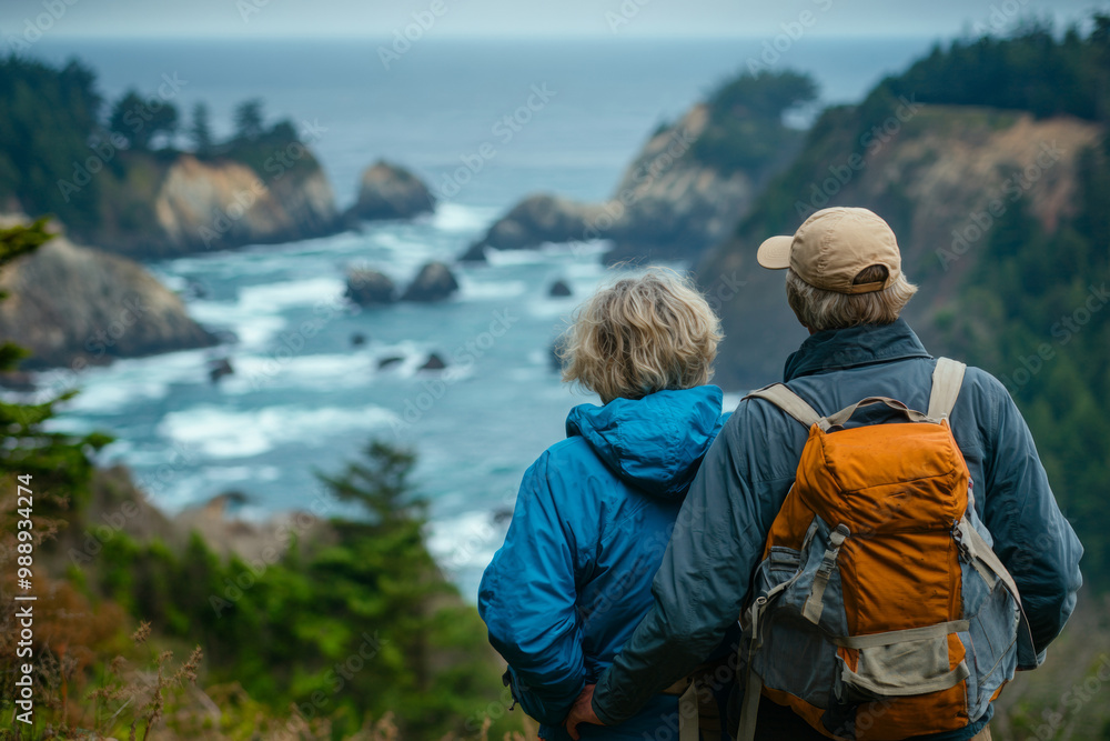 An elderly couple stands together on a trail, admiring the dramatic cliffs and rolling waves below. Mist envelops the coastline, enhancing the serene atmosphere. An elderly couple stands together on a trail, admiring the dramatic cliffs and rolling waves below. Mist envelops the coastline, enhancing the serene atmosphere.