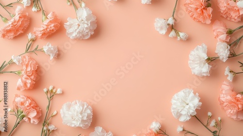 A floral arrangement of pink and white carnations on a soft peach background.