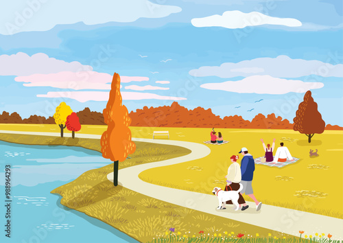 People enjoying a leisurely walk and relaxation by the lake colored in autumn leaves
