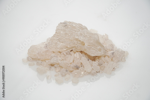 Aromatic heap of Damar Mata Kucing (Shorea Javanica) resin gum best quality grade, also known as Dammar gum, isolated on a clean white background. photo