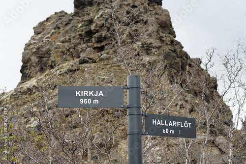 Dimmuborgir, Skútustaðir, Iceland - direction signs to Kirkja and Hallarflöt at trail path area in large lava field photo