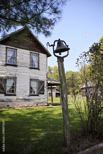 Old Antique Dinner Bell Mounted on Post in American Pioneer Village