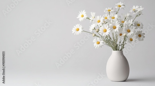 Wallpaper Mural A soft, pastel-colored bouquet of daisies, displayed in a modern vase, set against a smooth white background Torontodigital.ca