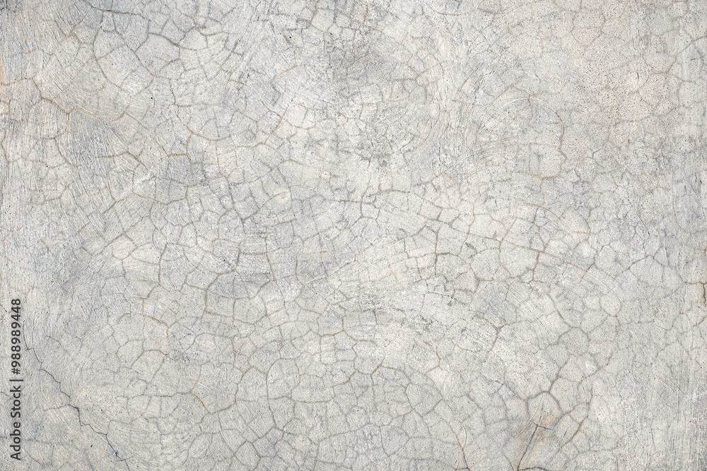 A cracked, weathered concrete surface with intricate circular patterns. The texture showcases natural aging, with visible cracks and roughness, perfect for industrial, rustic, or construction-themed d A cracked, weathered concrete surface with intricate circular patterns. The texture showcases natural aging, with visible cracks and roughness, perfect for industrial, rustic, or construction-themed d