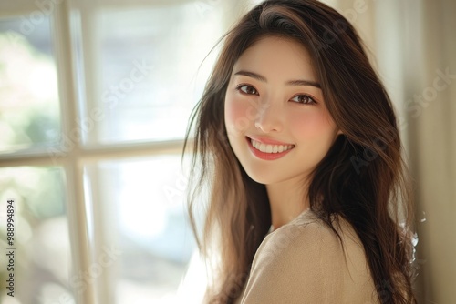 Beautiful Japanese woman smiling, natural lighting, simple background.