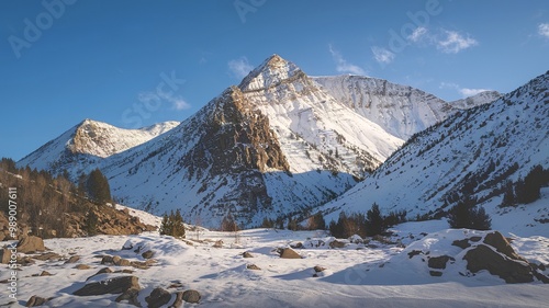 A breathtaking snowy mountain landscape under a clear blue sky