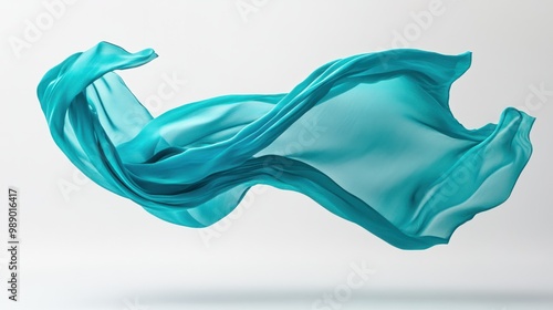 Vibrant turquoise fabric floating freely in mid-air, creating elegant motion against white.