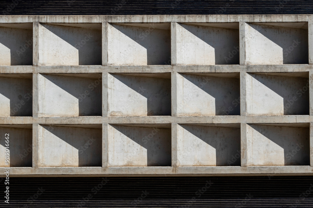 Architectural detail of the facade of a building with concrete blocks. Architectural detail of the facade of a building with concrete blocks.