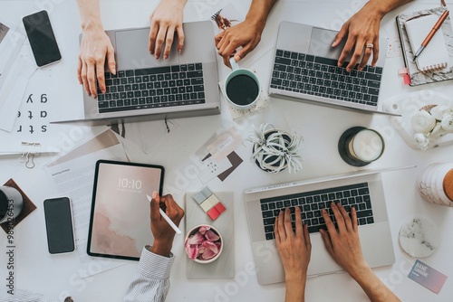 Businesswomen using digital devices at work